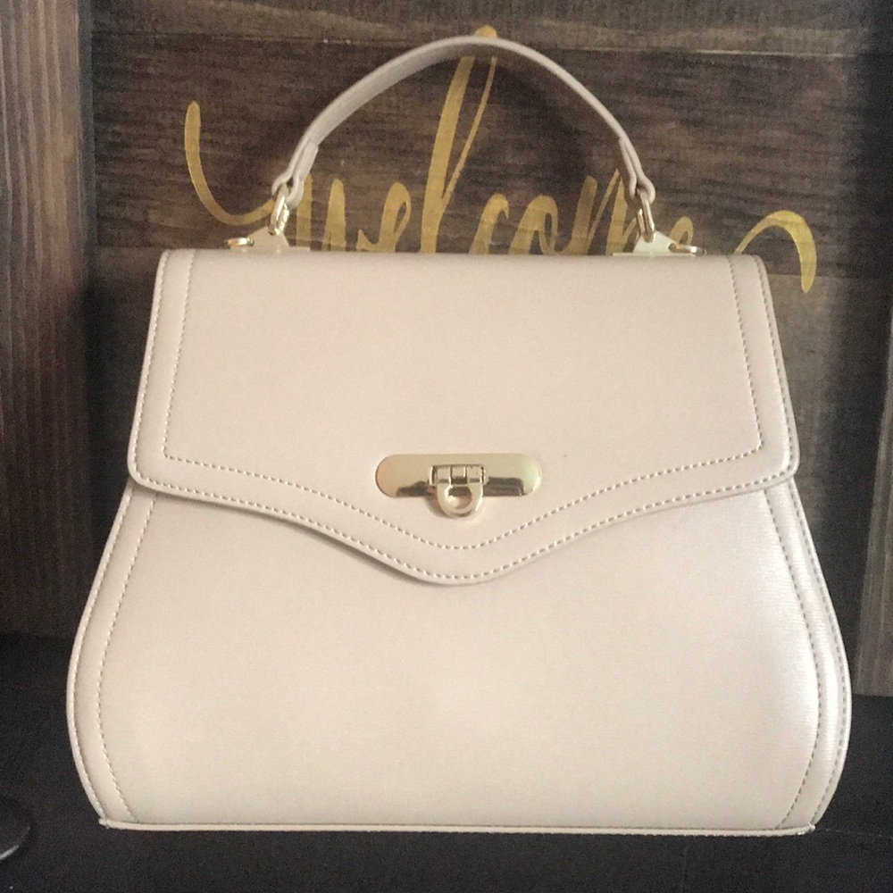 Nude/natural colored women’s Kadell handbag